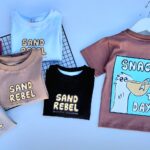 REMERAS OVERSIZE DE BEBE SAND REBEL