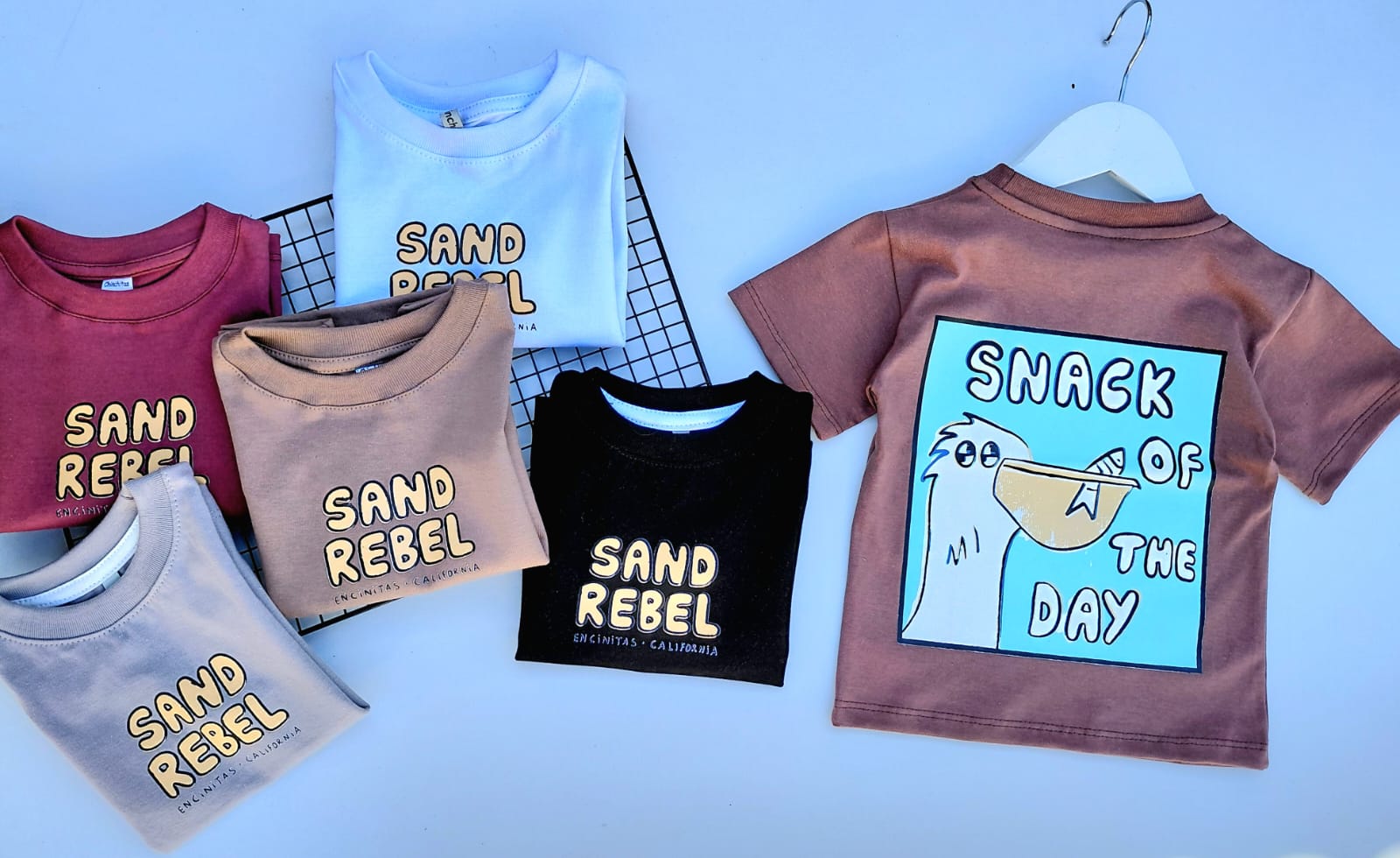 WhatsApp Image 2026-09-15 at 12.08.17 REMERAS OVERSIZE DE BEBE SAND REBEL - Imagen 1